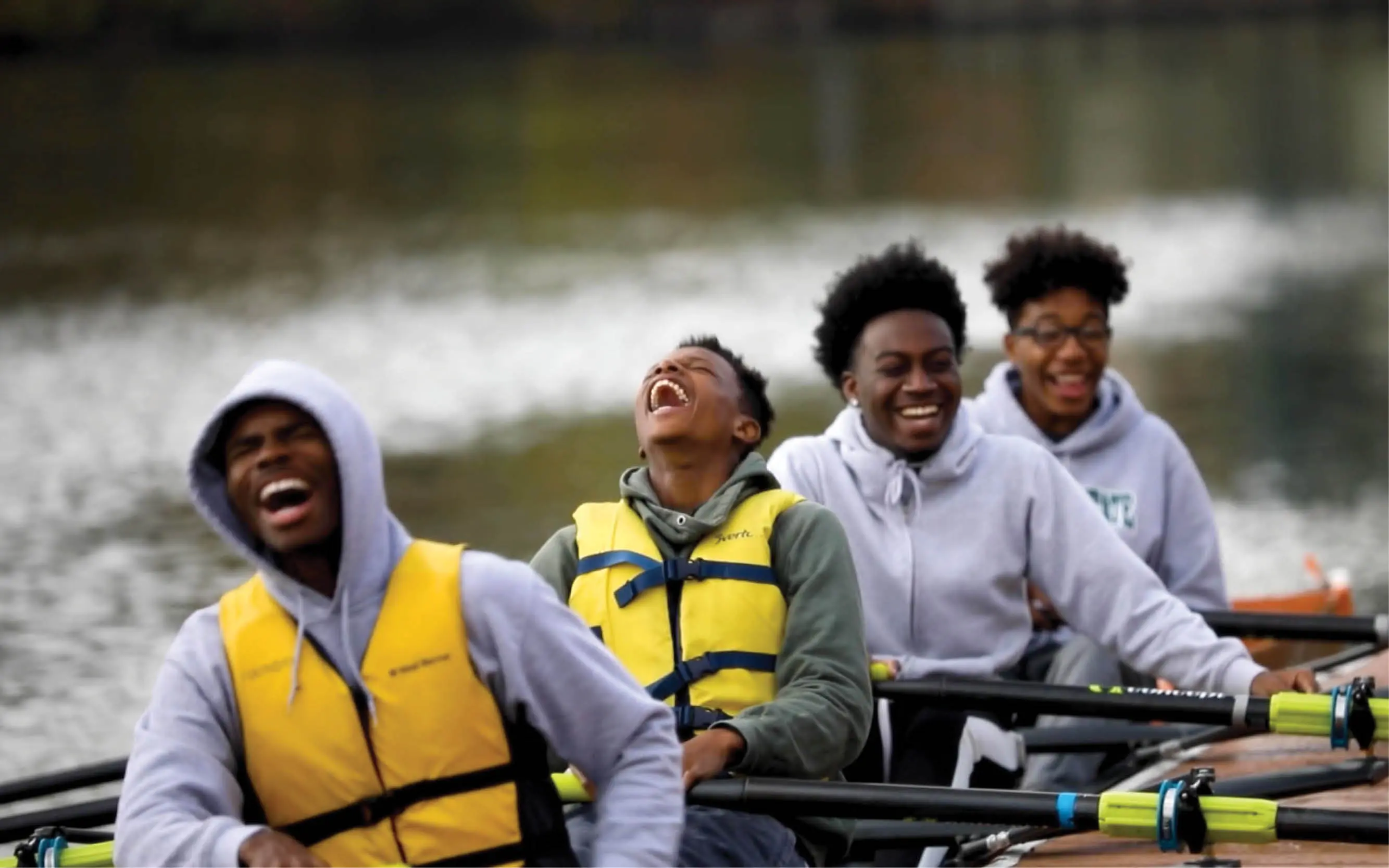 diverse School of ONE students rowing a boat at The Cleveland Foundry