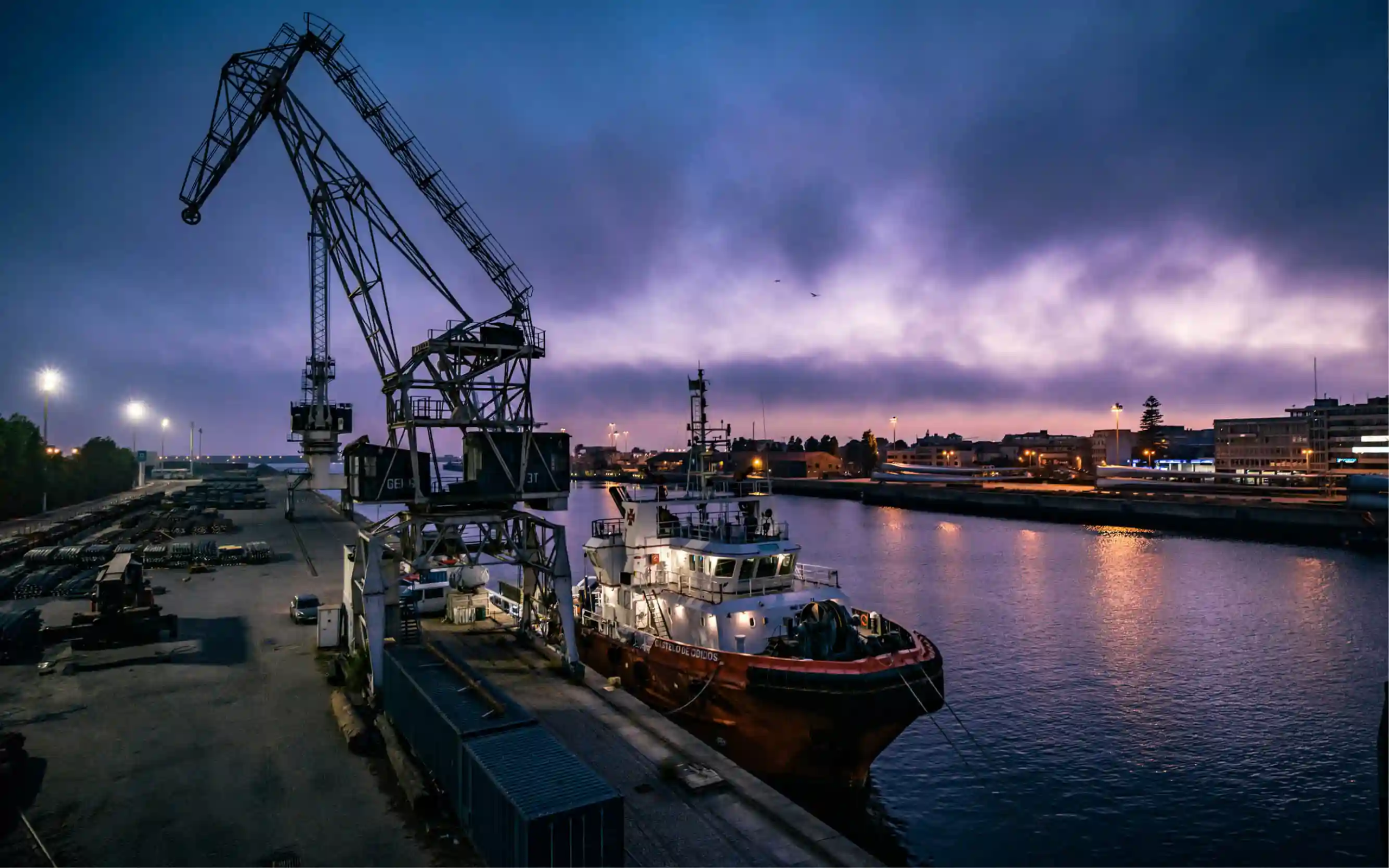 cargo ship on a river depicting international trade, imports and exports, and tarrifs